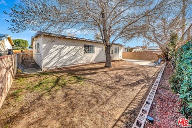 This charming single-story home blends mid-century character - photo 35
