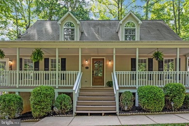 Welcome to this beautifully renovated waterfront retreat on the - photo 1