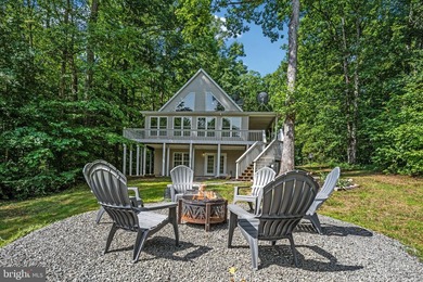 Welcome to this beautifully renovated waterfront retreat on the - photo 4