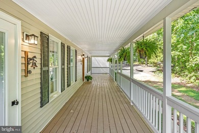 Welcome to this beautifully renovated waterfront retreat on the - photo 6