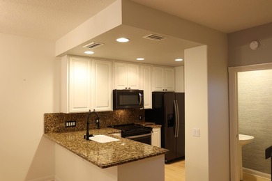 Nestled in the highly desirable Tequesta Oaks community, this - photo 3