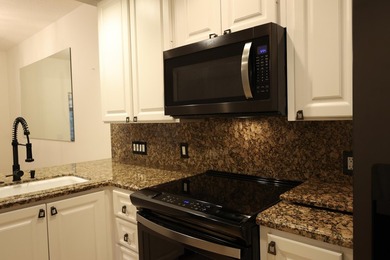 Nestled in the highly desirable Tequesta Oaks community, this - photo 4