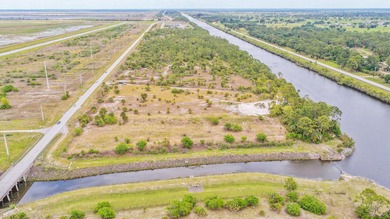 Set along 5+ pristine acres on the storied St. Lucie River, this - photo 13