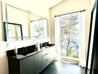 Completed in 2023, this Tennessee River Modern Masterpiece is - photo 14