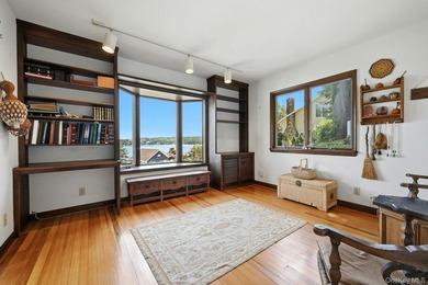 Nestled into the hillside with water views that hold through - photo 13
