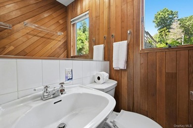 Nestled into the hillside with water views that hold through - photo 15