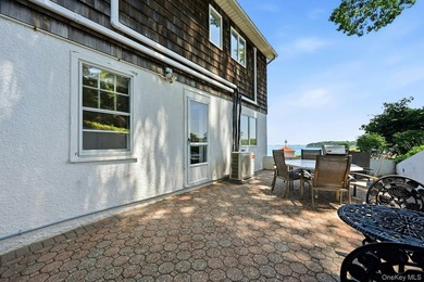 Nestled into the hillside with water views that hold through - photo 27