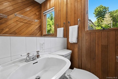 Nestled into the hillside with water views that hold through - photo 29