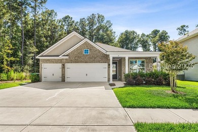 Tucked away on a private, wooded lot, this stunning single-story - photo 1