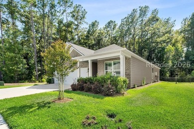 Tucked away on a private, wooded lot, this stunning single-story - photo 3