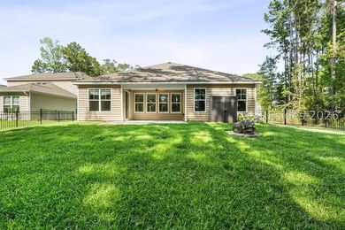 Tucked away on a private, wooded lot, this stunning single-story - photo 6