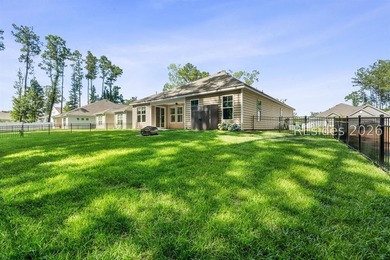 Tucked away on a private, wooded lot, this stunning single-story - photo 7