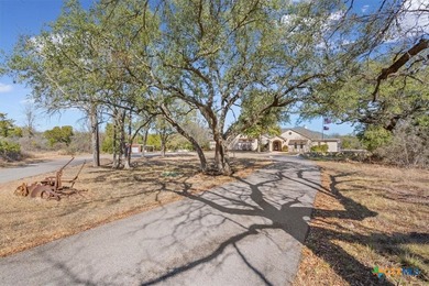 Tucked away on 15 serene, wooded acres through two private - photo 3