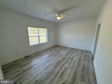 6.26 ACRES WITH POND ACCESS! Enjoy country living in this - photo 7