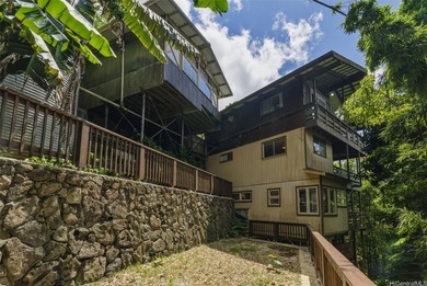 Nestled in lush Tantalus, above the Honolulu cityscape, this - photo 22