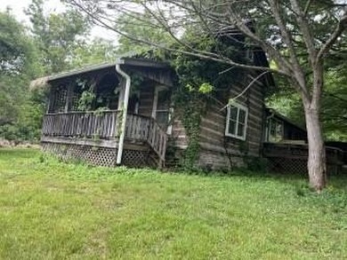 Older log home that has been rebuilt at the present location - photo 1