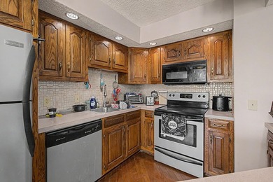 Welcome to this top-floor end-unit condo in Cypress Bay, located - photo 9