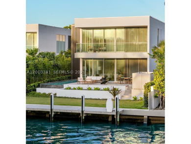 This one-of-a-kind, two-story waterfront villa, designed by - photo 1