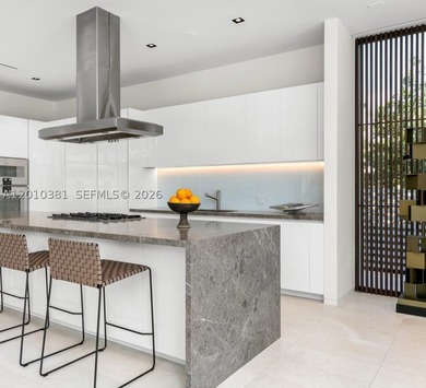 This one-of-a-kind, two-story waterfront villa, designed by - photo 3