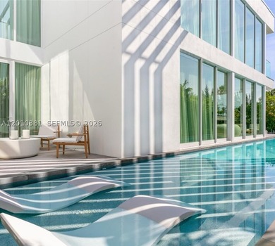 This one-of-a-kind, two-story waterfront villa, designed by - photo 5