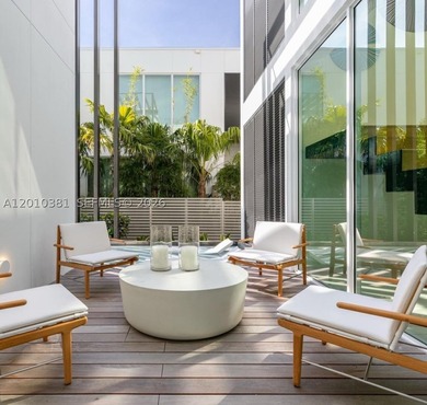 This one-of-a-kind, two-story waterfront villa, designed by - photo 6