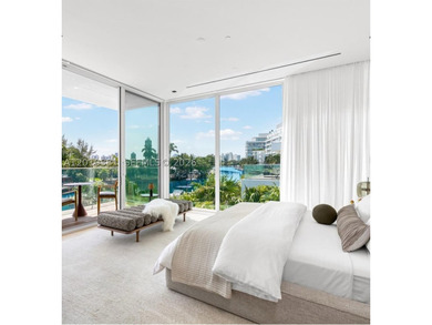 This one-of-a-kind, two-story waterfront villa, designed by - photo 7
