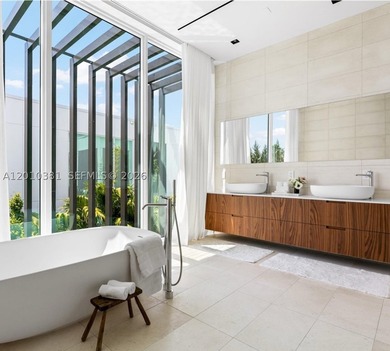 This one-of-a-kind, two-story waterfront villa, designed by - photo 9