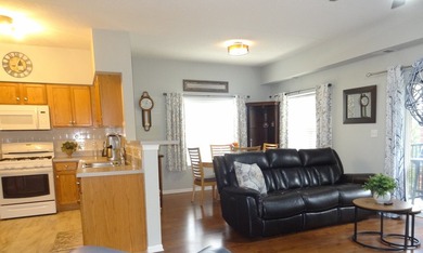 Perfectly perched on the first floor yet above grade level, this - photo 4