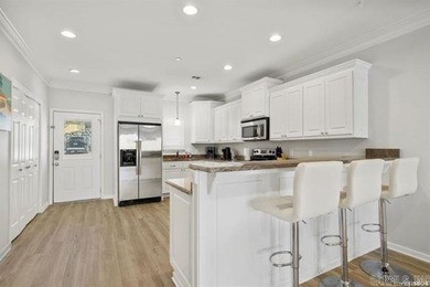 Experience lake living at its finest with this beautiful walk-in