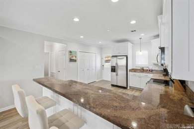 Experience lake living at its finest with this beautiful walk-in