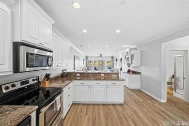 Experience lake living at its finest with this beautiful walk-in