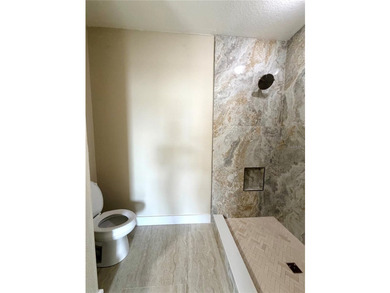 This 4/2 home has a renovated interior showcasing modern - photo 15