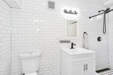 Welcome to 191 Suffolk Avenue, a warm and inviting two-family - photo 11