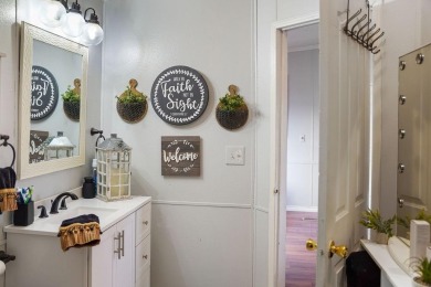 1.4 acres, this doublewide manufactured home offers four