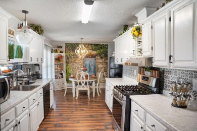 1.4 acres, this doublewide manufactured home offers four