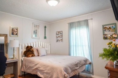 1.4 acres, this doublewide manufactured home offers four