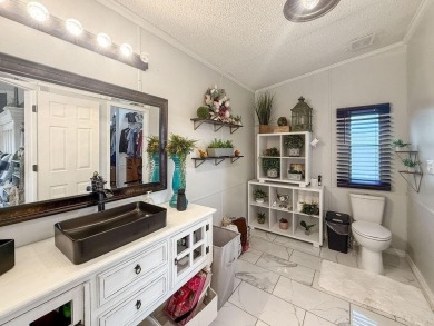 1.4 acres, this doublewide manufactured home offers four