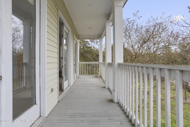 This two-story Coastal Southern Style home is nestled in a - photo 35