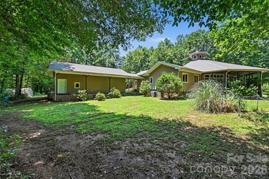 Tucked away on over 4 private wooded acres in the desirable - photo 33