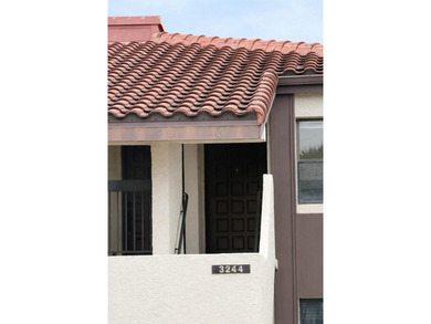 Welcome to this inviting second-floor condo located in the - photo 2