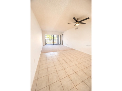Welcome to this inviting second-floor condo located in the - photo 3