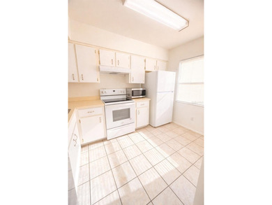Welcome to this inviting second-floor condo located in the - photo 4
