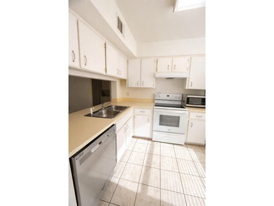 Welcome to this inviting second-floor condo located in the - photo 5