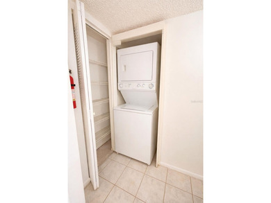 Welcome to this inviting second-floor condo located in the - photo 7