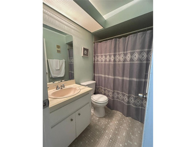 Welcome to this inviting second-floor condo located in the - photo 8