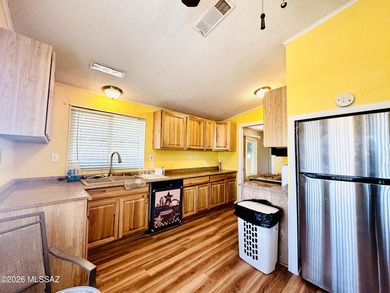 Step into this vibrant manufactured home just minutes from the