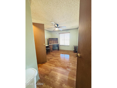 Step into this vibrant manufactured home just minutes from the