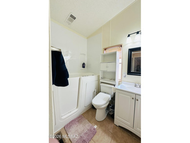 Step into this vibrant manufactured home just minutes from the