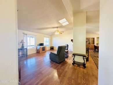 Step into this vibrant manufactured home just minutes from the