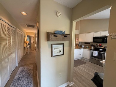 Updated and attractive second-floor end-unit villa featuring two - photo 4